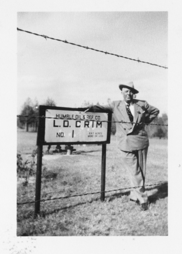 Malcolm Crim stands by his discovery oil well on his mother's East Texas farm.