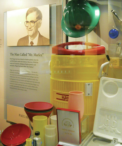 Bartlesville-Examiner-Hogan-with-products petroleum product hula hoop image of museum exhibit of petroleum products and Paul Hogan photo