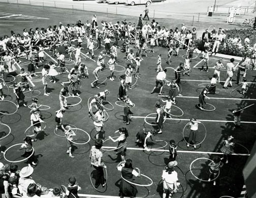 hula-hoop--circa-1960-AOGHS About 100 young people hula hooping together circa 1960.