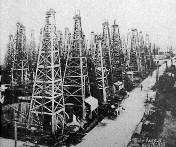"Boiler Avenue, April 23, 1901." Although the Spindletop field will produce more oil in one day than the rest of the world’s oilfields combined, excessive production will result in a collapse in oil prices.