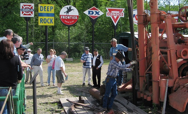 Volunteers at Kansas Oil Museum demonstrate antique spudder.
