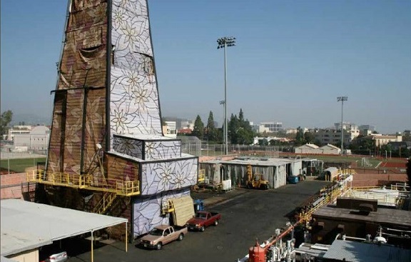 A modern camouflaged oil derrick in Los Angeles.