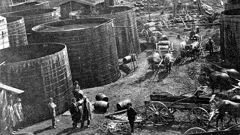 Rare photo of Pithole creek giant wooden oil storage tanks.